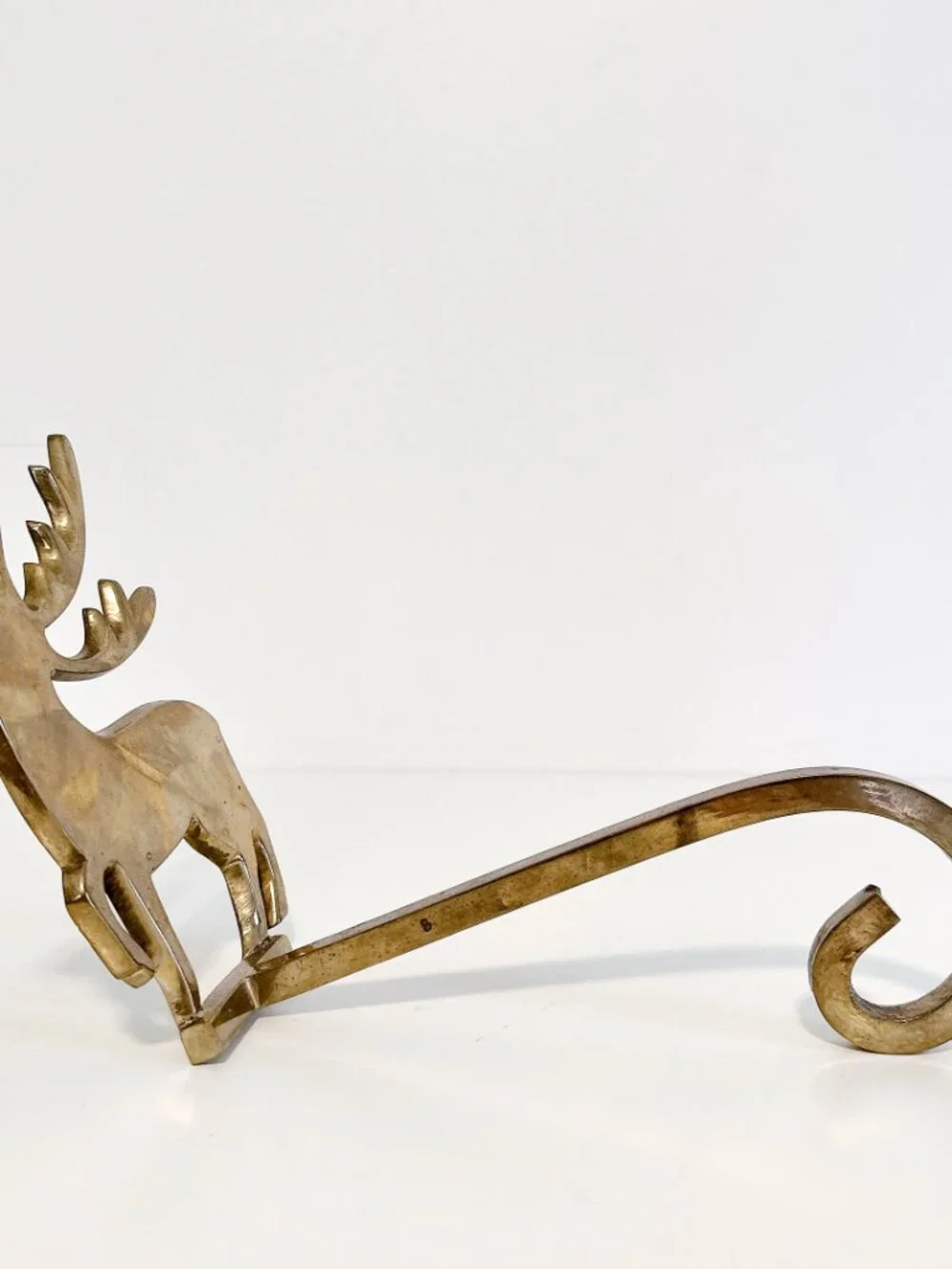 SET OF FOUR BRASS REINDEER MANTEL STOCKING HANGERS